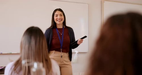 Woman Teacher Giving Lesson to Students in Classroom