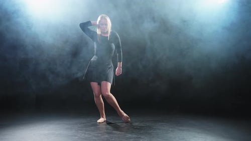 Contemporary Woman Dancer Posing on Black Background with Smoke Adult Female Artist Performer