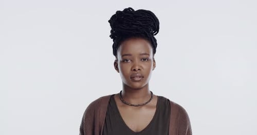 Frustrated, rolling eyes and face of black woman in studio for anger, bad attitude and rejection