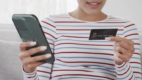 Woman Makes Online Purchase with Credit Card