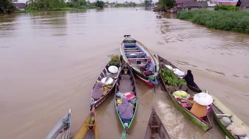Aerial view of floating market with traditional boats, Indonesia.