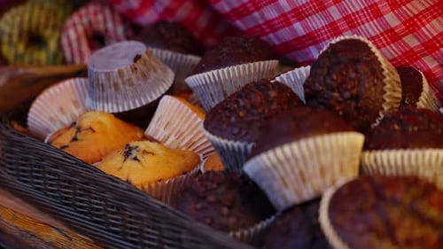 Basket full of chocolate and vanilla muffins