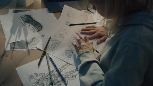 Female Creative Designer Works on Storyboard and Draws Sketches for Her Project
