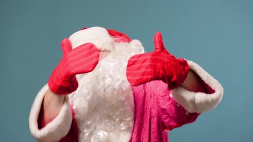 Blue Background Studio Shot Dance Expressive Santa Claus in Anticipation of Christmas and New Year