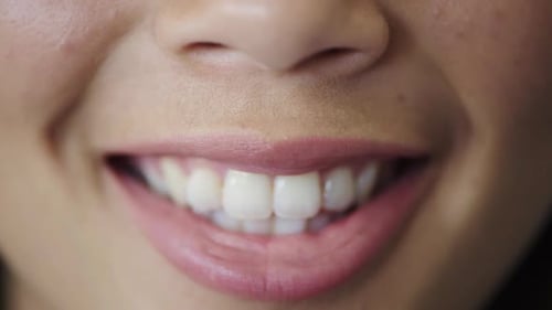 Woman's Radiant Smile in Extreme Close Up