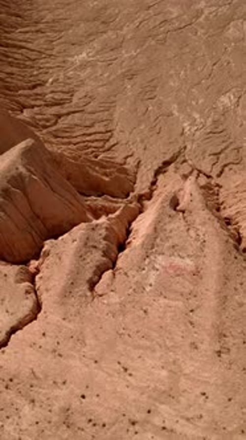 Vertical of Aerial Diving Down of Sand Career