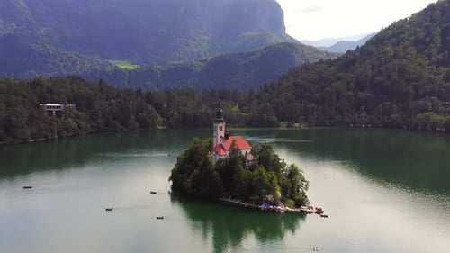 Lake Bled and the Church island of the assumption of Mary, Aerial footage on a beautiful Slovenian s