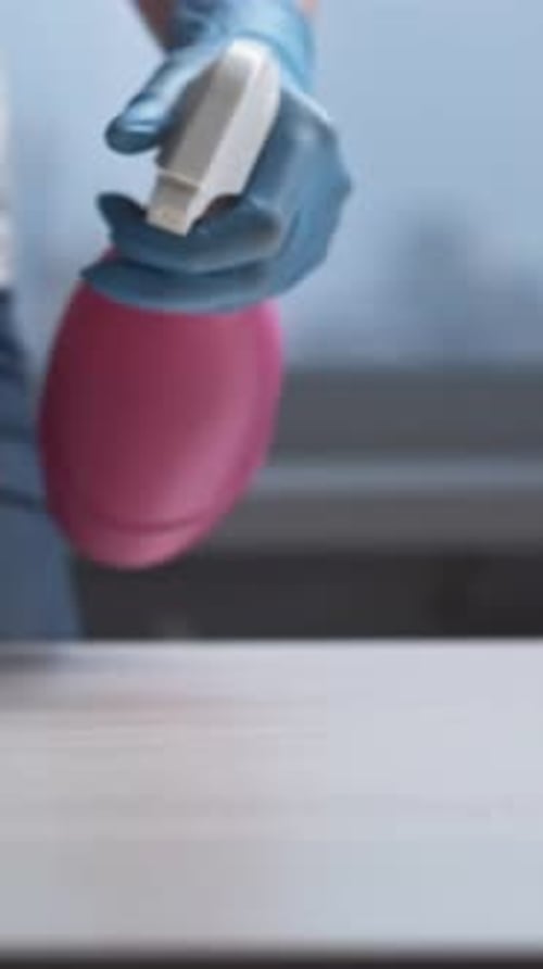 Cleaning Surface with Spray and Sponge at Home