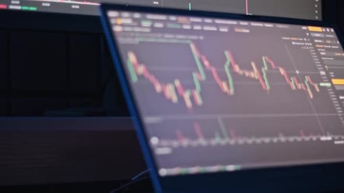 Stock Market Data on Laptop Screen