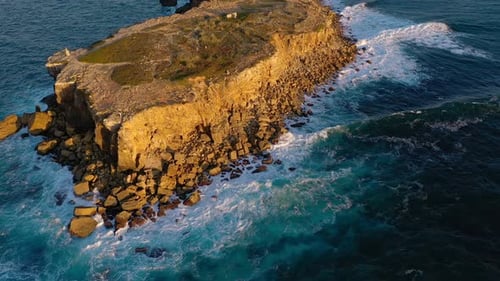 Aerial Seascape of Ocean Waves Break on Rocky Island Shores Portugal