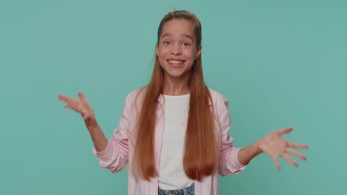 Surprised young woman reacts positively in mid shot