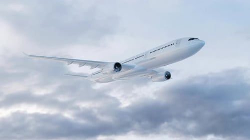 Side view of a commercial airplane flying above the clouds. Aerial view of a passenger plane
