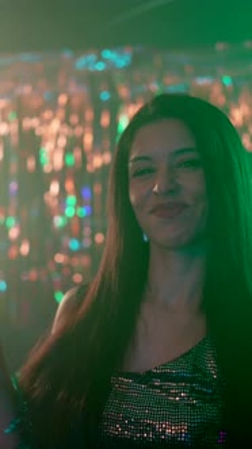 Woman Toasting with Champagne in Party Setting Portrait