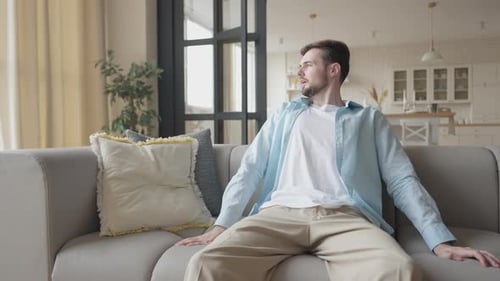 Man Relaxing at Home Playing Video Games
