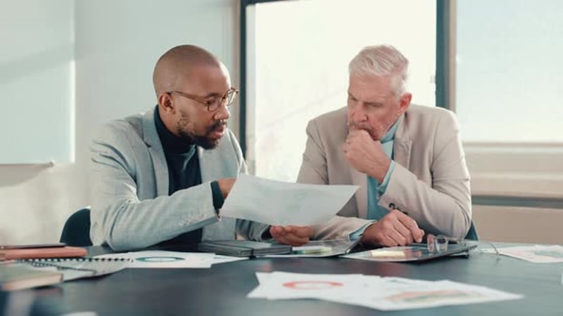 Business people, meeting and discussion with documents in office ...