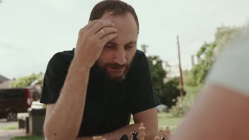 Man Thinking During Chess Game