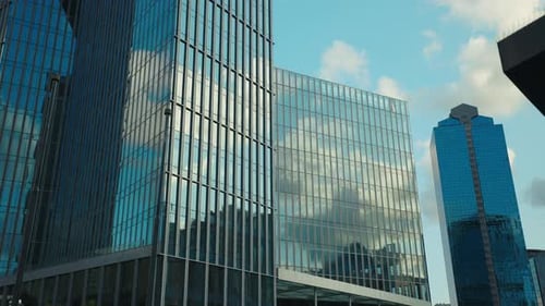 Modern Glass Skyscrapers in Urban Setting on Sunny Day