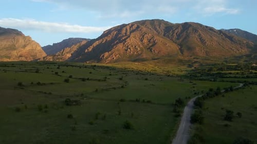 Aerial view mountain range with a road running through it