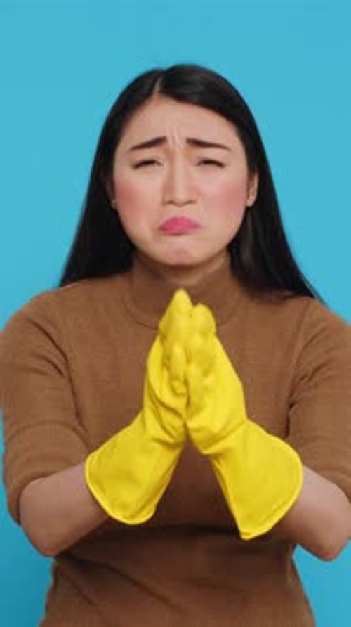 Vertical Video Portrait of Housewife Doing Pray Gesture in Front of Camera While Asking God to Help