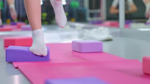 Leg View of Person Practicing Balance on Yoga Block for Stability Training