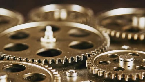 Rotating Gold Gears in a Mechanical Machine