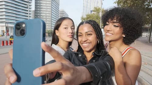 Transgender and Two Friends Taking a Selfie in the Street