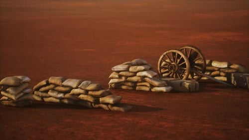 Vintage Military Sandbags and Artillery Wheels on Desert Ground