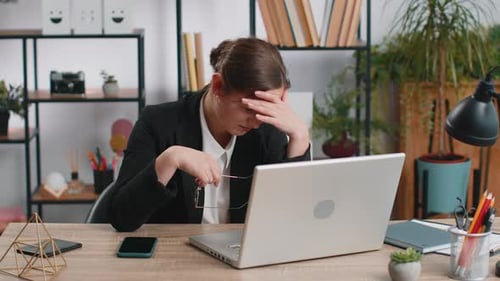 Businesswoman Working on Laptop Crosses Fingers, Gets Upset
