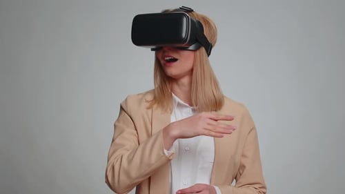 Woman Using VR Headset Interacting With Virtual World