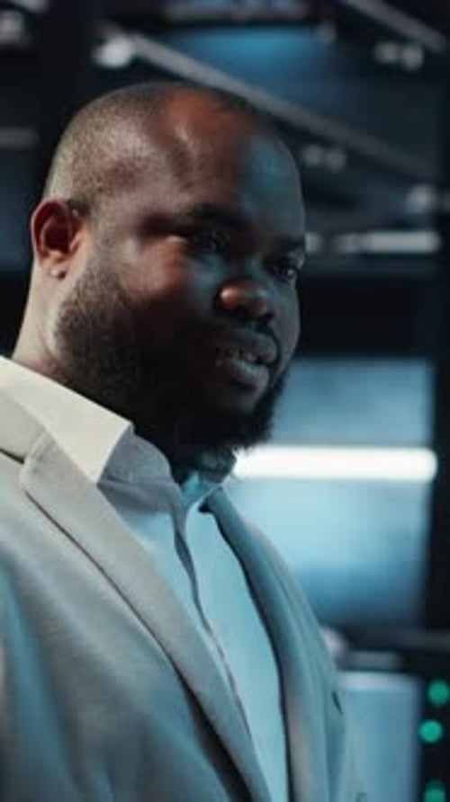 Vertical Video Data Center Engineer Adjusting Blade Server Hardware