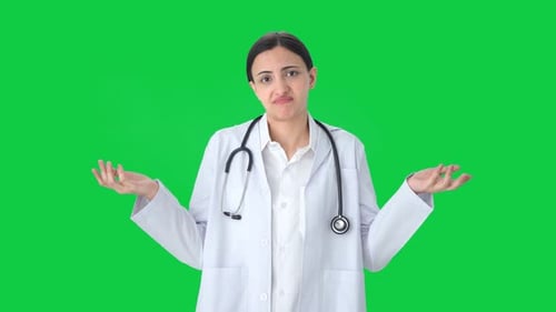 Confused Indian female doctor asking what question Green screen