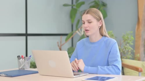Woman Talking During a Video Call on Laptop