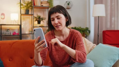 Woman on Video Call with Smartphone at Home