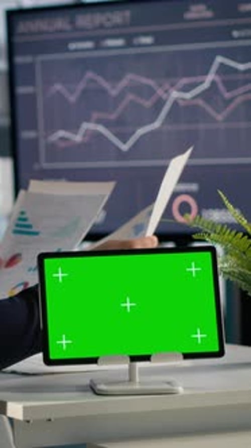 Vertical Video Isolated Mockup on Tablet with CEO Reviewing KPIs and Company Data