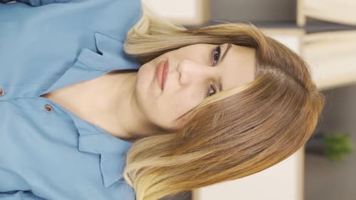 Pensive Woman Touching Face in Thoughtful Vertical Portrait