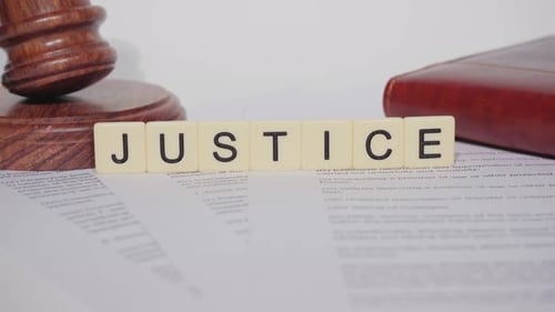 Justice Gavel and Legal Documents on White Background