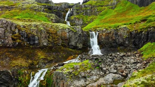 Wispy Waterfalls Flowing Over Cliff Mountain River Falling Over Cliff Creating Many Waterfalls with