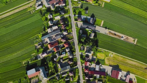 Aerial View of Decorative Ornaments of Diverse Green Fields and Houses