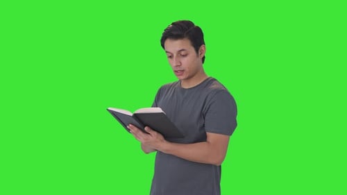 Indian man reading a book Green screen