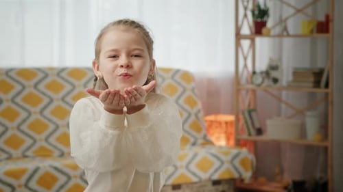 Cute Girl Sending Love to Camera