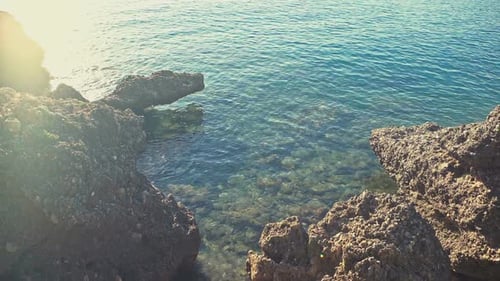 Rocky Coastline Meeting Clear Blue Ocean Waters