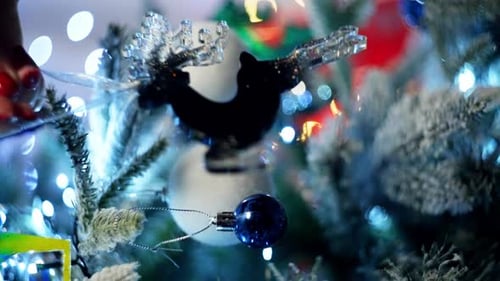 Decorating Christmas Tree with Ornaments