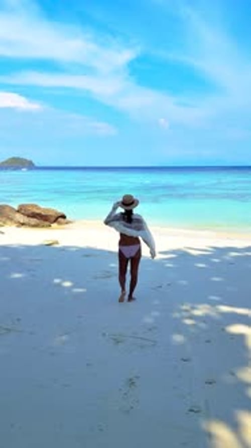 a Woman is Walking on a Beach Looking at the Ocean Koh Lipe Thailand