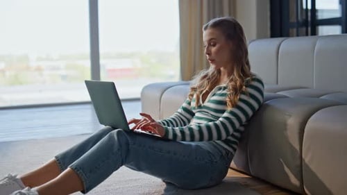 Woman with Laptop working from home