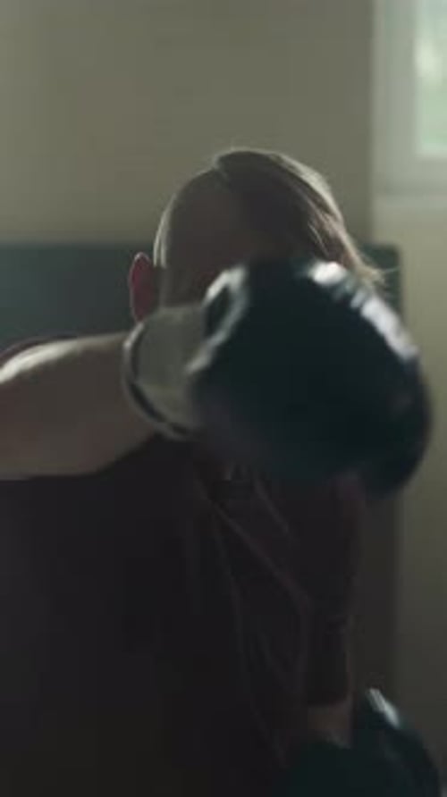 Sportsman Does Hooks and Uppercuts Training in Gym