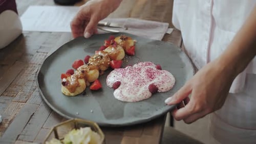 Close Up of Breakfast Plate with Pancakes and Cream