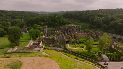 Villers Abbey Ruins are Surrounded By a Lush Green Forest Ancient Stone Walls and Arches Revealing