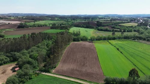 Panoramic View Of Agricultural Farmlands In Countryside. Aerial Shot