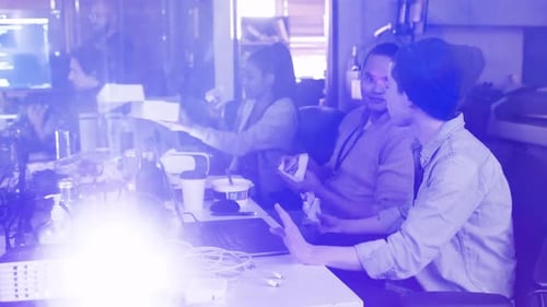 Office Team Eating Lunch at Shared Workspace Table