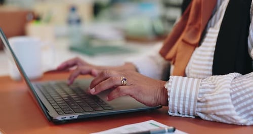 Adult Woman Typing on Laptop in Office